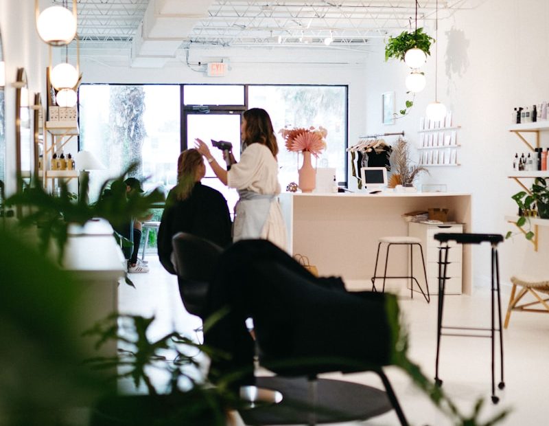a couple of people sitting at a table in a room